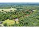This aerial view displays several lots bordered in red, surrounded by dense woodlands at 4658 Sugar Plum Ln, Davidson, NC 28036