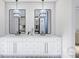 Elegant bathroom with double vanity, modern lighting, and patterned tile flooring at 4658 Sugar Plum Ln, Davidson, NC 28036