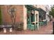 This inviting coffee shop features outdoor seating and a charming brick facade with artistic mural at 4658 Sugar Plum Ln, Davidson, NC 28036