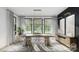 Bright dining room with elegant lighting, large windows, and modern decor at 4658 Sugar Plum Ln, Davidson, NC 28036