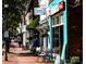 Charming street view featuring local shops with outdoor seating on a sunny day at 4658 Sugar Plum Ln, Davidson, NC 28036