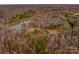 Aerial view of a wooded lot near a pond at 1052 Ventosa Dr, Denver, NC 28037