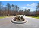 Grand community entrance with stone pillars and gates at 1052 Ventosa Dr, Denver, NC 28037