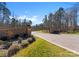 Gated community entrance with stone wall and landscaping at 1052 Ventosa Dr, Denver, NC 28037