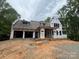 Exterior view of a house under construction with dark window frames and gray roof at 1052 Ventosa Dr, Denver, NC 28037