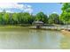 Quaint lakeside gazebo with a wooden dock at 1052 Ventosa Dr, Denver, NC 28037