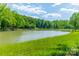 Serene lake view with lush green surroundings at 1052 Ventosa Dr, Denver, NC 28037