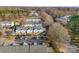 Aerial view of townhouses, parking, and surrounding trees at 6436 Mallard View Ln, Charlotte, NC 28269