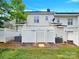 Private backyard with white vinyl fence and two AC units at 6436 Mallard View Ln, Charlotte, NC 28269