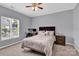 Spacious bedroom with a queen bed and ample natural light at 6436 Mallard View Ln, Charlotte, NC 28269