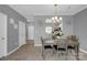 Bright dining room features a table with four chairs and access to the kitchen at 6436 Mallard View Ln, Charlotte, NC 28269