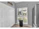 Laundry closet with white doors and window overlooking the parking lot at 6436 Mallard View Ln, Charlotte, NC 28269