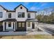 Modern townhome with white exterior and black metal roof at 204 Kimball Rd, China Grove, NC 28023