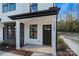 Modern home exterior with black front door and white siding at 204 Kimball Rd, China Grove, NC 28023