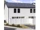 Modern house exterior with white siding, black windows, and a white fence at 204 Kimball Rd, China Grove, NC 28023