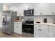 Modern kitchen with stainless steel appliances and white cabinets at 204 Kimball Rd, China Grove, NC 28023