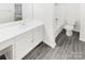 Bright bathroom featuring a spacious vanity, modern fixtures, and a tiled shower-tub combination at 6003 Treetop Ct, Charlotte, NC 28212