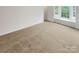 Bedroom featuring carpeted floor, and a window at 6003 Treetop Ct, Charlotte, NC 28212