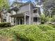Charming home featuring a covered front porch and two-story balcony with well-maintained landscaping at 6003 Treetop Ct, Charlotte, NC 28212