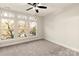 Bright bedroom featuring large windows providing ample natural light and neutral color palette at 1409 Collier Walk Aly # Csw0104, Charlotte, NC 28205