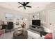 Living room with tv, desk, white walls and trim, and carpet at 1409 Collier Walk Aly # Csw0104, Charlotte, NC 28205