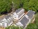 An aerial view of the townhome complex is shown with lush tree coverage at 1411 Collier Walk Aly # Csw0105, Charlotte, NC 28205