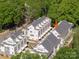 An aerial view highlights a new home with great architectural details nestled in a neighborhood full of trees at 1413 Collier Walk Aly # Csw0106, Charlotte, NC 28205