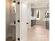 Modern bathroom features a pedestal sink, black hardware and fixtures, and wood grain flooring at 1413 Collier Walk Aly # Csw0106, Charlotte, NC 28205