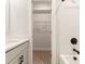 Bathroom view with white cabinets, sleek hardware, and tub shower combo at 1413 Collier Walk Aly # Csw0106, Charlotte, NC 28205