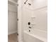 Bright bathroom featuring a white bathtub and black fixtures, as well as a walk-in closet at 1413 Collier Walk Aly # Csw0106, Charlotte, NC 28205
