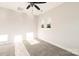 Neutral bedroom featuring carpeted floors, a ceiling fan, and natural light at 1413 Collier Walk Aly # Csw0106, Charlotte, NC 28205