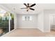 Bedroom with ceiling fan, sliding glass door to private balcony, and wood grain floors at 1413 Collier Walk Aly # Csw0106, Charlotte, NC 28205