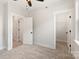 Neutral bedroom with ceiling fan and 2 different entryways to other rooms and closet at 1413 Collier Walk Aly # Csw0106, Charlotte, NC 28205