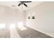 Bright bedroom featuring neutral walls, carpet flooring, ceiling fan, and natural light from the double windows at 1413 Collier Walk Aly # Csw0106, Charlotte, NC 28205