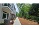 Modern townhome featuring a sidewalk, landscaped mulch bed, and partial brick facade at 1413 Collier Walk Aly # Csw0106, Charlotte, NC 28205