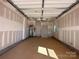 Unfinished two-car garage with concrete floor and white drywall at 1413 Collier Walk Aly # Csw0106, Charlotte, NC 28205