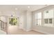 Bright and airy living area featuring an open floor plan, and staircase, and a large window overlooking the backyard at 1413 Collier Walk Aly # Csw0106, Charlotte, NC 28205