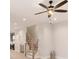 Open concept living room with updated ceiling fan and stairs to the second level at 1413 Collier Walk Aly # Csw0106, Charlotte, NC 28205