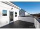 Outdoor deck featuring black deck boards, white siding, and easy access from the bonus room's glass panel door at 1413 Collier Walk Aly # Csw0106, Charlotte, NC 28205