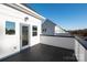 Rooftop deck featuring a dark wood floor and white railings at 1413 Collier Walk Aly # Csw0106, Charlotte, NC 28205