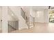 Open staircase with modern railings and wood steps leading to the upper level, connecting living spaces at 1413 Collier Walk Aly # Csw0106, Charlotte, NC 28205
