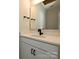 Single vanity bathroom featuring black fixtures, granite countertops, and an open mirror at 1211 E 34Th St # Csw0313, Charlotte, NC 28205