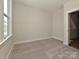 Empty bedroom featuring neutral walls, carpet flooring, and a window at 1211 E 34Th St # Csw0313, Charlotte, NC 28205