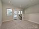 Spacious room featuring an entry way to stairs and a doorway leading outside at 1211 E 34Th St # Csw0313, Charlotte, NC 28205