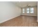 Bright living room with hardwood floors, recessed lighting, and large windows at 1211 E 34Th St # Csw0313, Charlotte, NC 28205