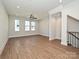 Open living room featuring hardwood floors, recessed lighting, and an abundance of natural light at 1211 E 34Th St # Csw0313, Charlotte, NC 28205