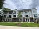 New townhome construction with eye-catching curb appeal, green lawn, and individual front entryways with balcony at 1219 E 34Th St # Csw0317, Charlotte, NC 28205