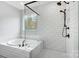 Contemporary bathroom features a modern tub, walk-in shower, and tiled walls at 2003 Cedar Falls Dr # 69, Waxhaw, NC 28173