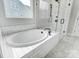Modern bathroom features a soaking tub, tiled shower, and sleek fixtures at 2003 Cedar Falls Dr # 69, Waxhaw, NC 28173
