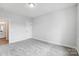 The carpeted bedroom features neutral paint, a closet, and ample space to make your own personal retreat at 2003 Cedar Falls Dr # 69, Waxhaw, NC 28173